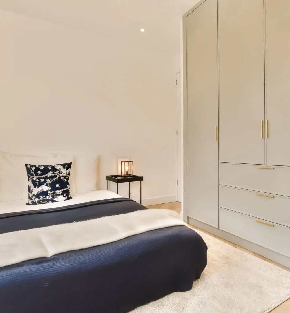 a-bedroom-with-a-bed-and-a-closet-2023-09-06-01-11-08-utc-scaled-1.webp